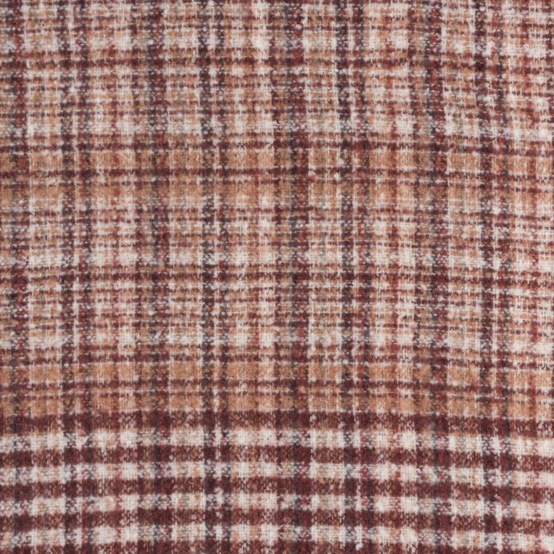 Rust and cream woven plaid scarf fabric shown in a close-up view, highlighting the soft textured weave and intricate check pattern in warm rust, cream and burgundy tones.