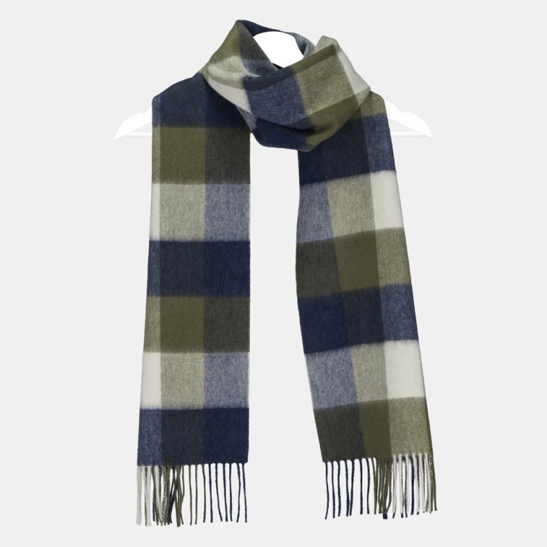 Navy, olive green and cream oversized check scarf with bold colour block squares, featuring a soft brushed texture, classic tartan-inspired design, and fringed ends, displayed draped on a hanger.