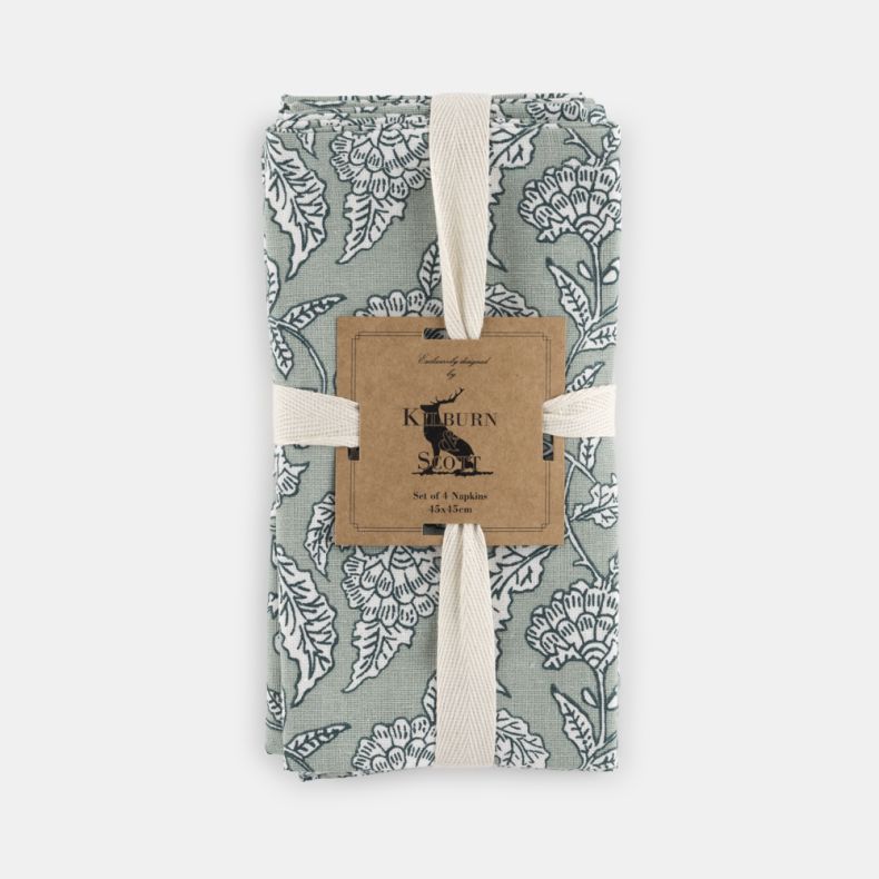Set of four Kilburn & Scott napkins in soft sage green, featuring an elegant heritage-inspired floral pattern in white. Neatly folded and presented with a decorative sleeve, these fabric napkins combine timeless country charm with a muted colour palette, 