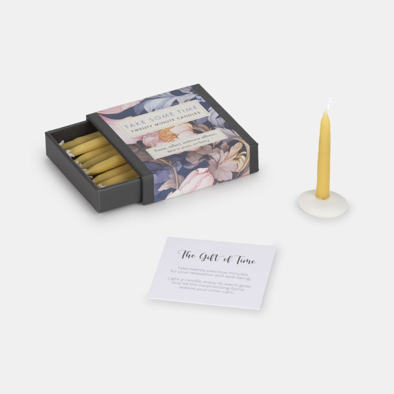 Gift set featuring a floral-design matchbox-style box containing twenty-minute candles, a single yellow candle in a white holder, and an inspirational card titled “The Gift of Time.” Designed for relaxation, mindfulness, and thoughtful gifting.