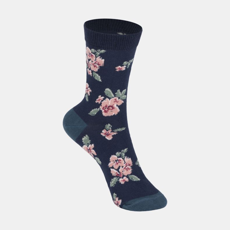 Navy blue floral ankle socks with soft pink flower pattern, sage green leaves, contrasting teal heel and toe, and a ribbed cuff.
