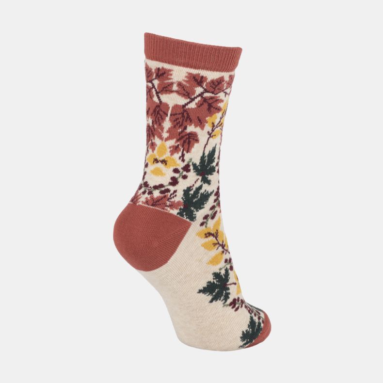 Cream botanical ankle socks with autumn-inspired leaf and berry pattern, featuring rust orange cuffs, heel and toe, with yellow, burgundy and dark green foliage shown from an angled rear view.
