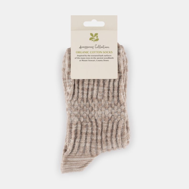 Beige marl organic cotton socks with a soft textured knit effect and subtle heathered pattern, displayed folded with retail packaging.