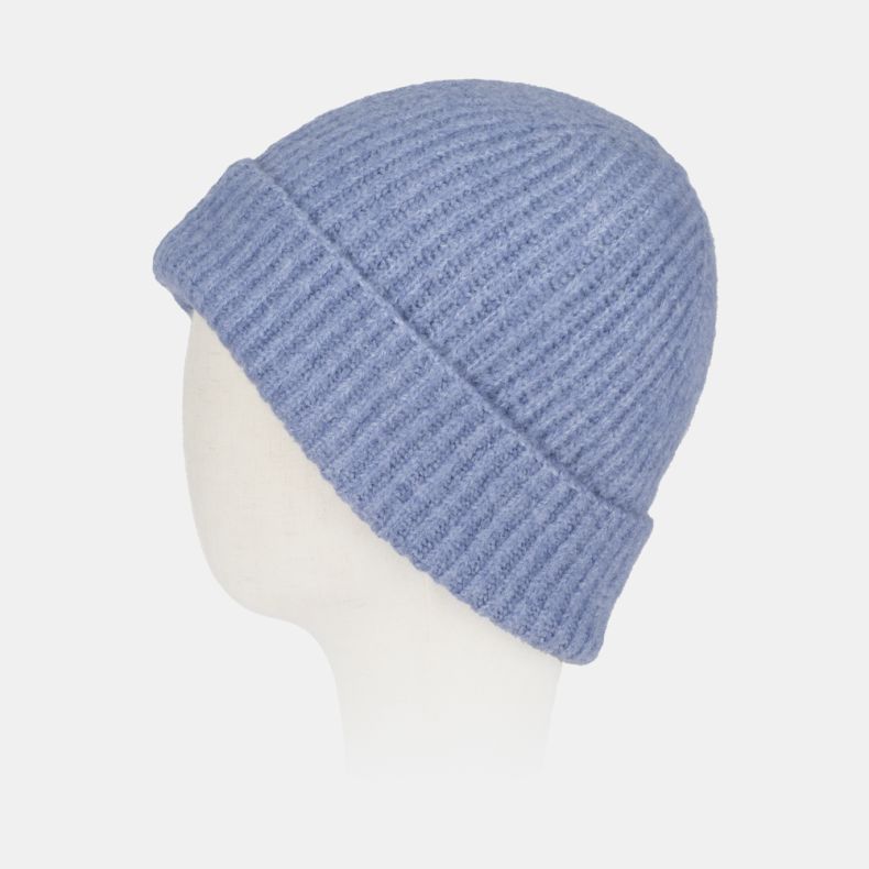 Light blue ribbed knit beanie hat with a soft fluffy texture, chunky turn-up brim, and cosy winter design, shown from an angled side view.
