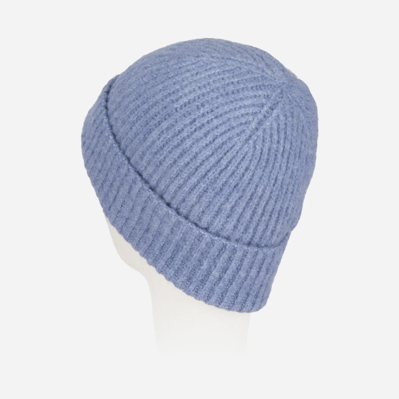 Light blue ribbed knit beanie hat with a soft fluffy texture, chunky turn-up brim, and cosy winter design, shown from a rear angled view.