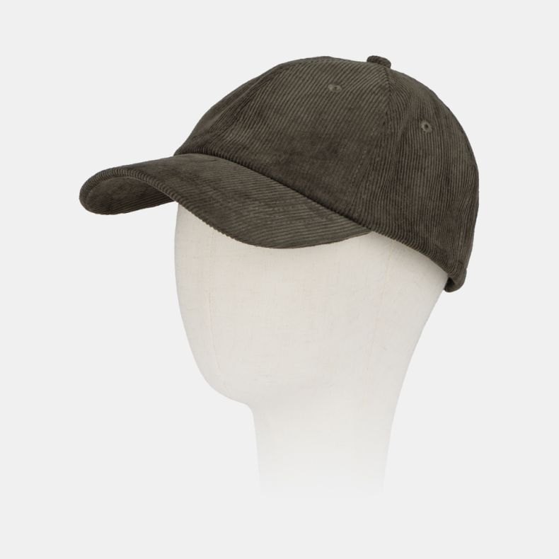 Green corduroy baseball cap with a classic six-panel design, curved peak, embroidered ventilation eyelets, and soft fine-wale cord texture, shown from an angled front view.