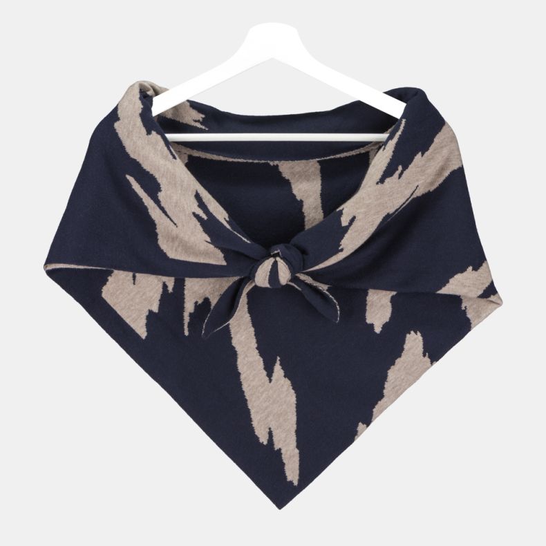Navy and beige triangular knitted scarf with a bold abstract pattern, soft fine-knit texture, and wrap-around design, displayed tied at the front on a hanger for stylish cold-weather layering.