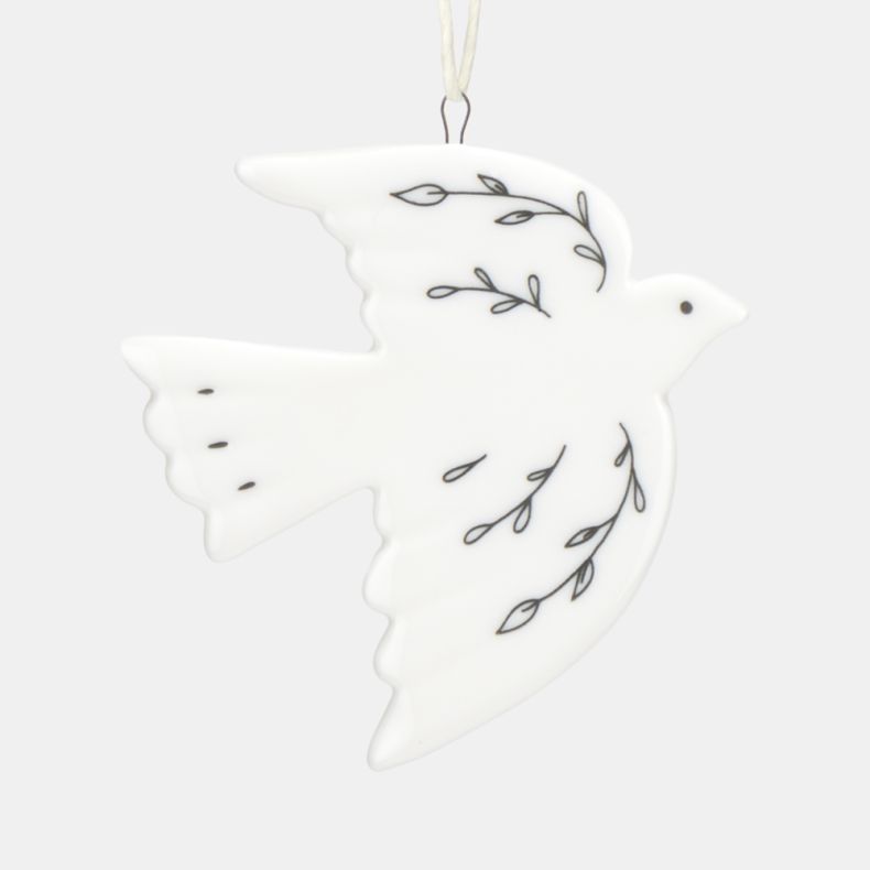 White ceramic dove Christmas hanging decoration shown in a close-up reverse view, featuring delicate black botanical line illustrations, a smooth glazed finish, and a cream hanging ribbon, designed as a symbolic festive ornament for seasonal décor.
