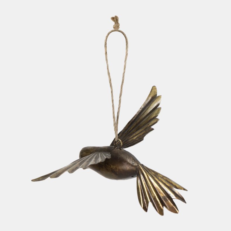 Gold-tone metal bird hanging decoration shown from a rear angled view, featuring a sculpted flying bird design with embossed feather detailing, outstretched wings, an antique brass-effect finish, and a rustic twine hanging loop for festive seasonal décor.
