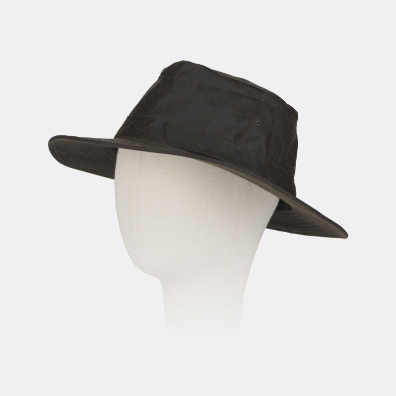 Dark green waxed cotton outdoor hat displayed on a mannequin head, featuring a wide brim for sun and rain protection, a structured crown, and a weather-resistant finish. The practical country-style hat is shown against a plain light background.
