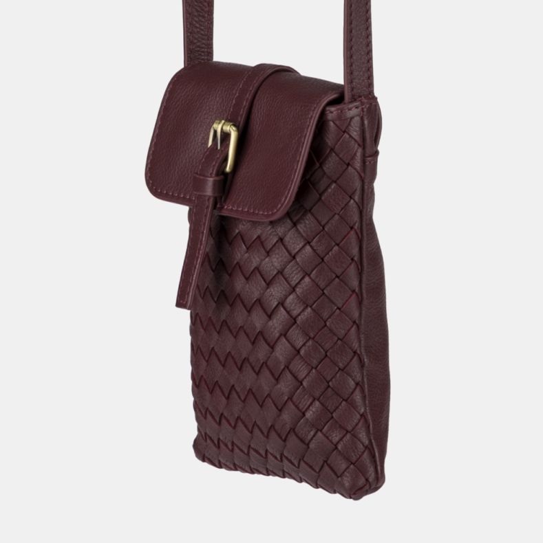 Burgundy woven crossbody phone bag shown in a close-up angled view, highlighting the basketweave texture, flap-over closure with gold-tone buckle detail, adjustable shoulder strap, and pebbled leather-look finish.