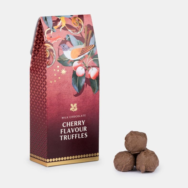 Milk chocolate cherry flavour truffles in a festive gift box with bird and cherry illustrations, displayed alongside three chocolate truffles.