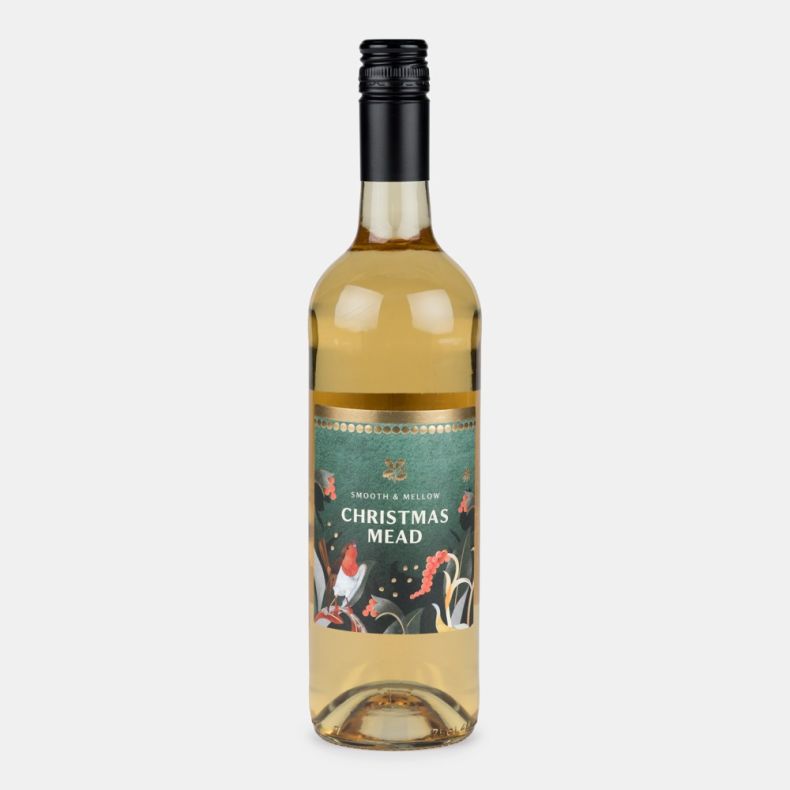 Bottle of Christmas mead with a festive illustrated label featuring a robin, winter foliage and berries, presented on a light grey background.