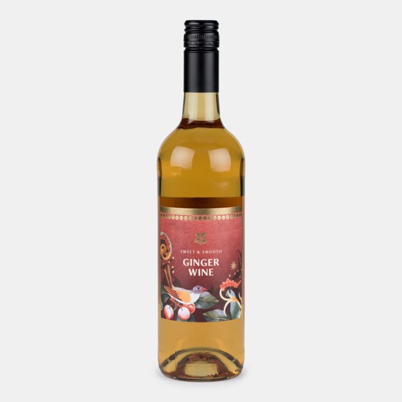Bottle of sweet and smooth ginger wine with a festive illustrated label featuring a bird, cherries and seasonal foliage, presented on a light grey background.