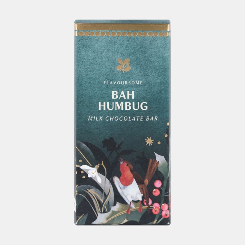 Bah Humbug milk chocolate bar in festive dark green packaging featuring a robin, holly leaves, red berries and snowdrops, shown front on.