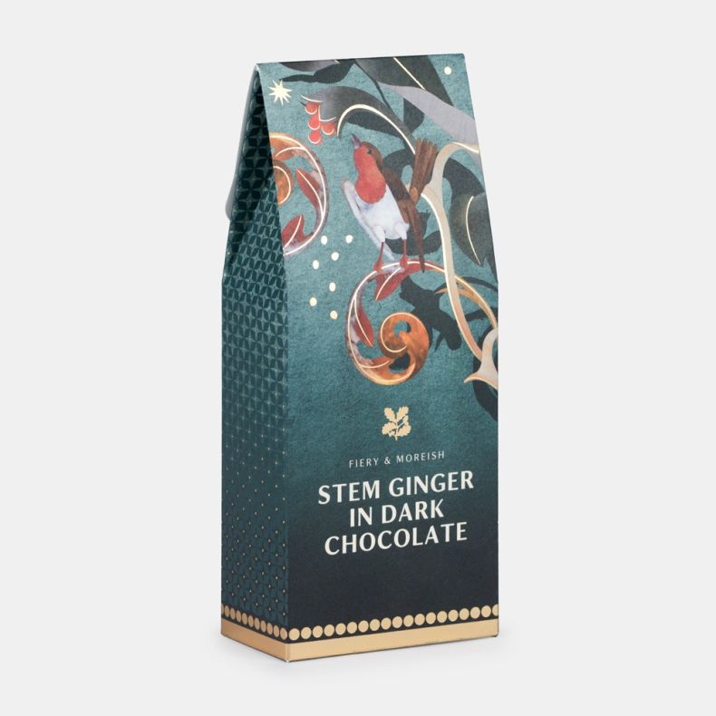 Stem ginger in dark chocolate confectionery gift box in festive teal packaging featuring a robin, decorative botanical illustrations and gold accents, shown at an angled view.