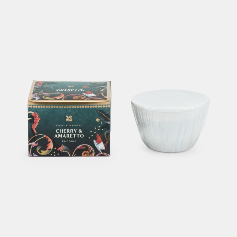 Cherry & amaretto pudding presented in a festive teal gift box with robin and botanical illustrations, displayed alongside the individually wrapped pudding in a white microwave-safe basin.