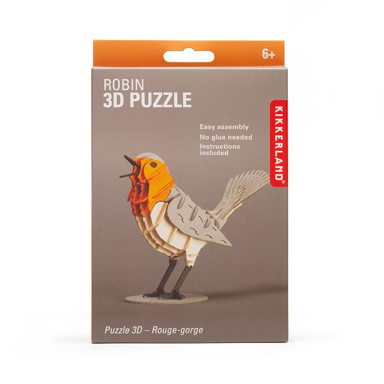 Front of Kikkerland Robin 3D Puzzle kit box featuring a completed robin bird model made from layered puzzle pieces. Packaging highlights easy assembly, no glue required, included instructions, and suitability for ages 6 and up.