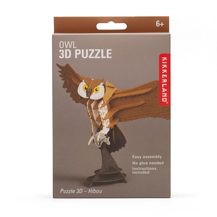 Front of Kikkerland Owl 3D Puzzle kit box featuring a completed owl model with outstretched wings. Packaging highlights easy assembly, no glue required, included instructions, and suitability for ages 6 and up.