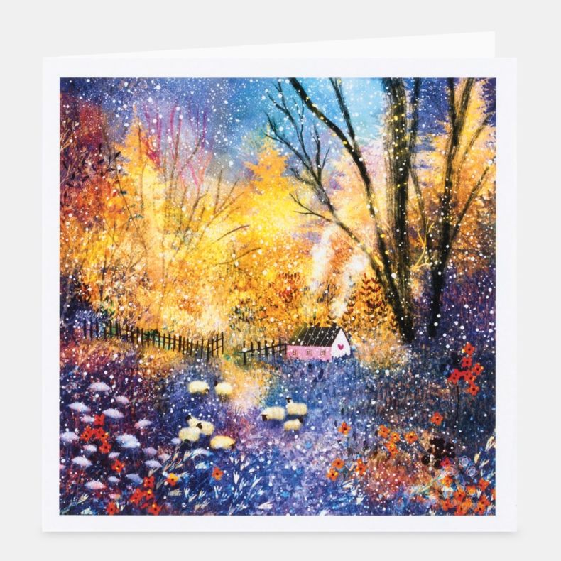 Cosy Cottage notecard featuring a colourful woodland illustration of a small pink cottage beside a winding path, surrounded by flowering plants, sheep and tall trees glowing with golden autumn light, with a vibrant mix of blue, purple, orange and yellow t