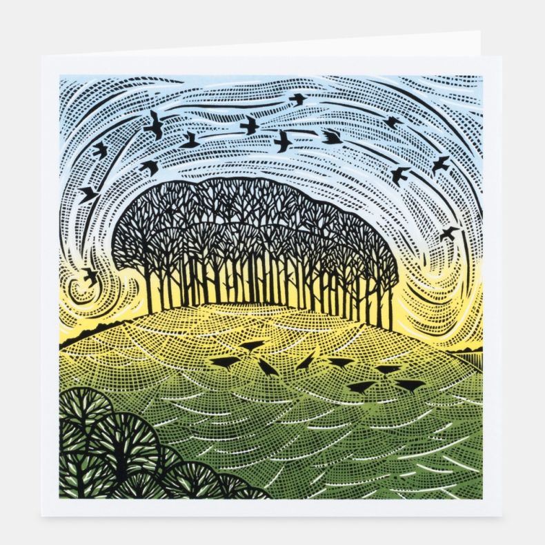 Countryside Encounters notecard featuring a linocut-style countryside illustration of a copse of trees on rolling green fields beneath sweeping patterned skies, with a flock of birds flying overhead and stylised birds foraging in the foreground, rendered 