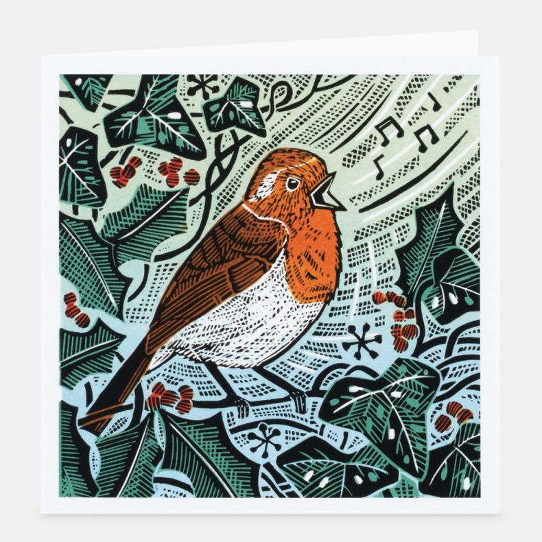 Countryside Encounters notecard featuring a linocut-style illustration of a robin perched among ivy leaves and red berries, with musical notes and patterned details in the background, rendered in shades of orange, green, cream and black, displayed with a 