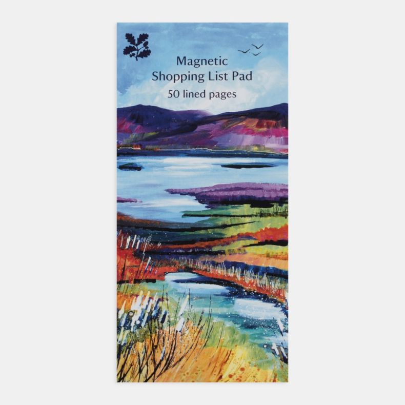 National Trust magnetic shopping list pad featuring a colourful landscape illustration of lakes, wetlands and rolling hills in shades of blue, purple, green and gold, with the text “Magnetic Shopping List Pad” and “50 lined pages” on the cover, displayed 