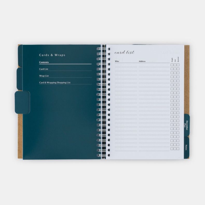 National Trust Christmas Planner opened to the Cards & Wraps section, featuring tabbed dividers and dedicated planning pages for Christmas card and gift wrap organisation. The right-hand page includes a card list template with columns for recipient names,