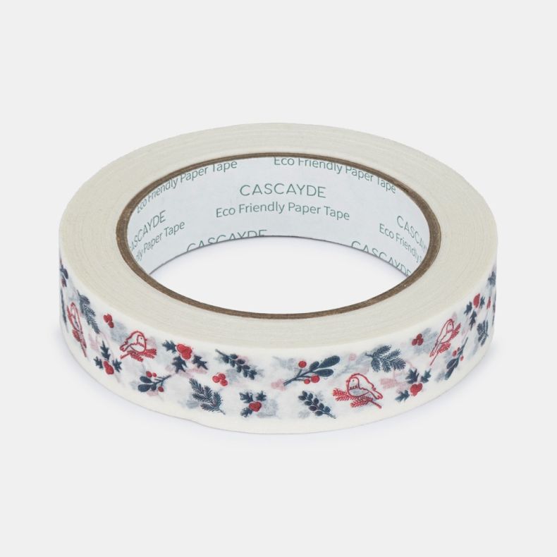 Roll of eco-friendly paper tape featuring a festive winter design with red songbirds perched among holly leaves, berries, pine sprigs and foliage, printed on a white background and shown on a white backdrop.
