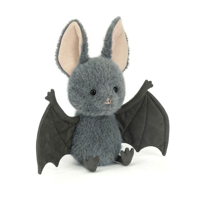 Side angle of a Grey fluffy bat plush toy with large cream-lined ears, outstretched dark grey wings, and small feet, photographed against a light grey background.