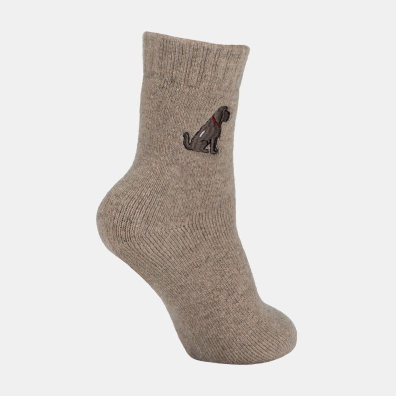 Light brown ankle sock with a soft marl texture and ribbed cuff, featuring an embroidered brown dog motif with a red collar on the outer ankle, shown from an angled side view against a white background.