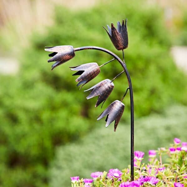 Metal Bluebell Garden Plant Stake featuring five handcrafted bell-shaped flowers on curved stems with a rustic bronze-effect finish, designed to add decorative height and interest to flower beds, borders and garden planters.