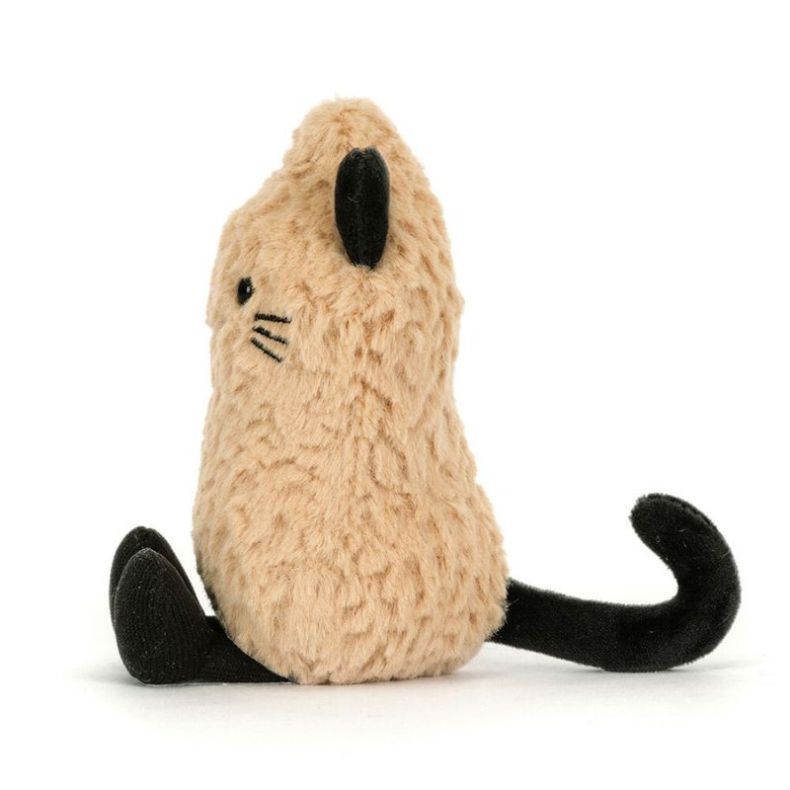 Tan fluffy cat plush toy shown from the side, featuring black ears, embroidered whiskers, a curled black tail, and black corduroy feet, photographed against a light grey background.