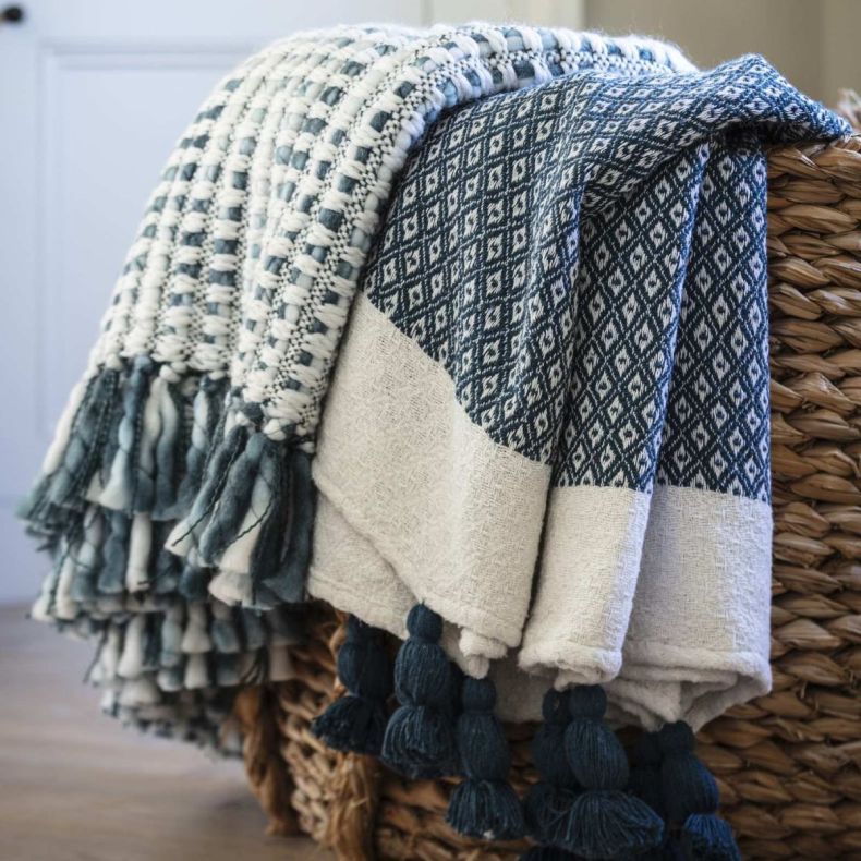 Teal diamond weave throw in a basket