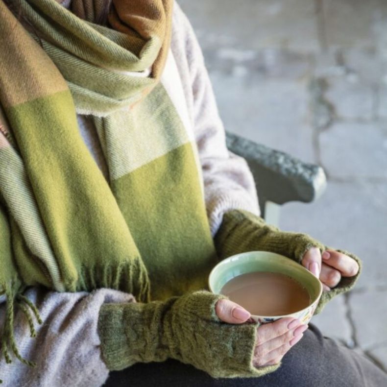 Knitted green check scarf and knitted fingerless gloves