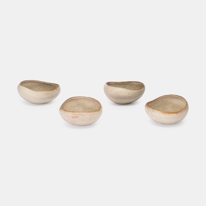Set of four oatmeal-coloured ceramic bowls with a speckled glaze finish and organic, asymmetrical shape. Displayed individually to showcase the handcrafted design, each bowl features soft neutral tones and a rustic aesthetic against a plain light grey bac