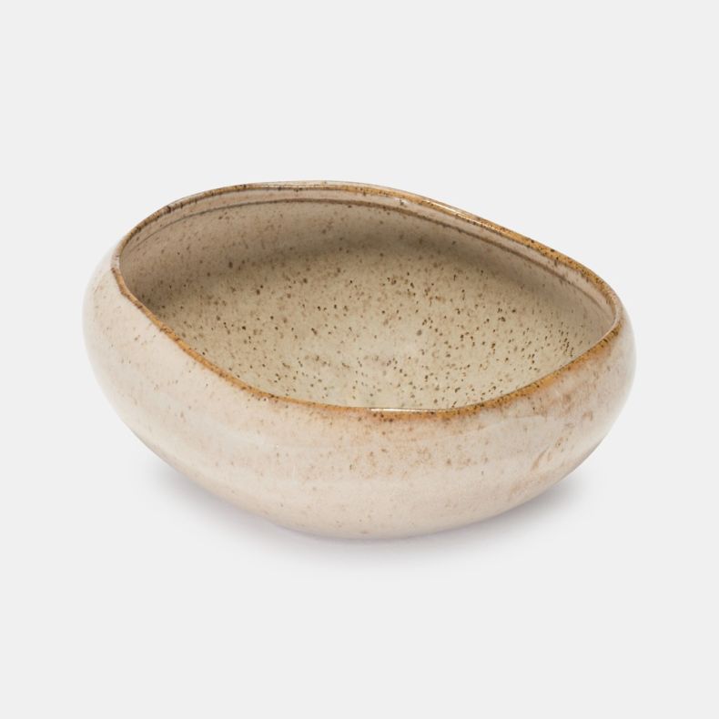 Close-up of an oatmeal-coloured ceramic bowl with a speckled glaze finish and organic asymmetrical shape. The detailed view highlights the textured interior, subtle flecking and handcrafted character, set against a plain light grey background.