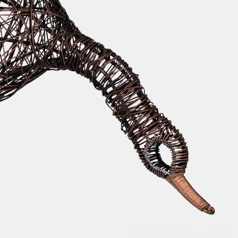 Close-up of decorative wire bird sculpture showing the long curved beak crafted from intertwined metal wire in a rustic brown finish