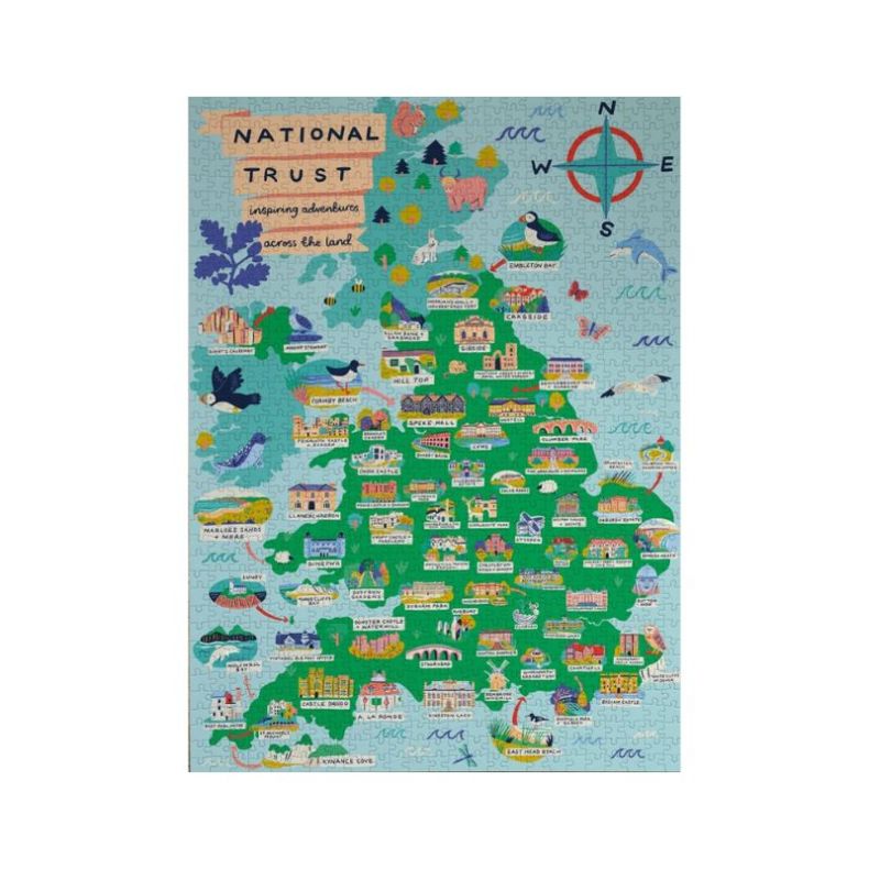 Completed National Trust Across the Land 1000-piece jigsaw puzzle featuring a colourful illustrated map of the United Kingdom. The detailed artwork highlights iconic National Trust properties, historic landmarks, wildlife, gardens and coastal locations, a