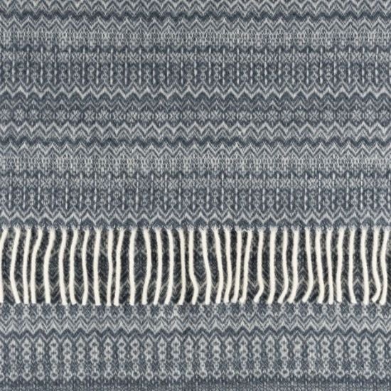 A blue fair isle pattern throw from the National Trust