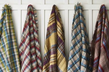 Picnic blankets hanging in a hallway